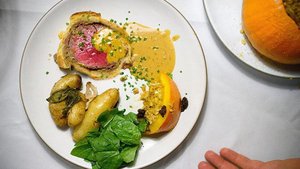 Beef Wellington with Roasted Potatoes and Wilted Greens