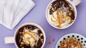 Gooey Chocolate Microwave Mug Cake with Caramel Sauce and Peanuts