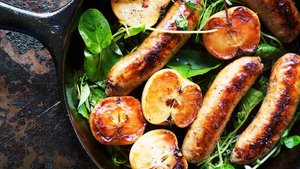 Pan-Seared Sausage With Lady Apples and Watercress