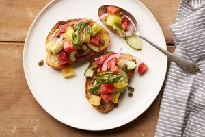 Panzanella Tomato Toast with Crispy Capers and Basil Leaves